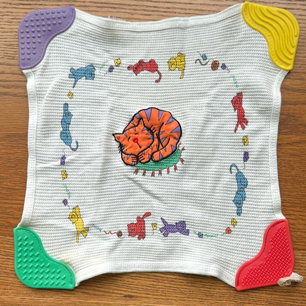 Teething towel with rubber corners